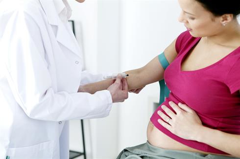 pregnant woman getting blood drawn