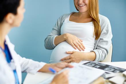 Pregnant woman talking to a doctor