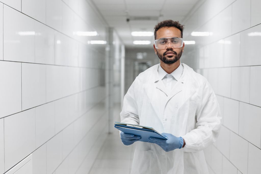 Lab technician handling workplace drug screening in Idaho with secure testing equipment.