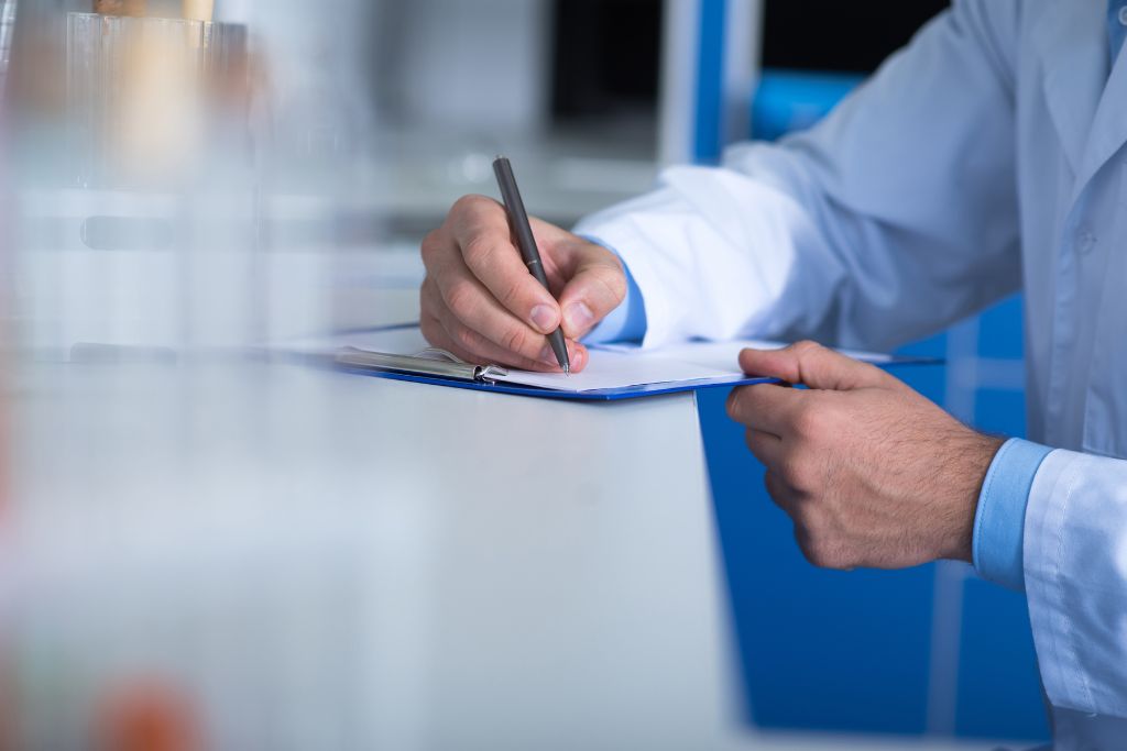 HR or safety manager documenting reasonable suspicion observations during workplace drug testing procedures.